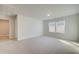 Bright bedroom features a large carpeted space, large windows, neutral walls, and interior door at 117 Belvedere Rd, Mcdonough, GA 30253