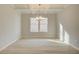 Formal dining room with elegant chandelier and natural light at 117 Belvedere Rd, Mcdonough, GA 30253