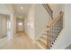 Inviting entryway featuring a staircase with wooden railing at 117 Belvedere Rd, Mcdonough, GA 30253