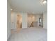 Upstairs hallway features carpeted floors, closet, staircase, and multiple interior doorways at 117 Belvedere Rd, Mcdonough, GA 30253
