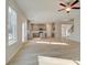 Open layout with a view of the kitchen and light-colored floors at 117 Belvedere Rd, Mcdonough, GA 30253