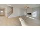 Open-concept living area with fireplace and modern staircase at 117 Belvedere Rd, Mcdonough, GA 30253