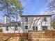 A well-maintained two-story home featuring a spacious wooden deck and neutral exterior paint at 4969 Portsmouth Ct, Lithonia, GA 30038