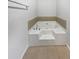 Bathroom features large tub with jets, tiled floor and side, and bright interior at 4969 Portsmouth Ct, Lithonia, GA 30038