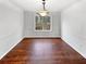 Dining room with hardwood floor, and natural light from a large window at 4969 Portsmouth Ct, Lithonia, GA 30038