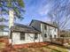 Exterior elevation of the two story home with a deck and a chimney at 4969 Portsmouth Ct, Lithonia, GA 30038