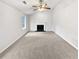Bright living room with a fireplace and ceiling fan at 4969 Portsmouth Ct, Lithonia, GA 30038