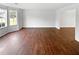Spacious living room featuring hardwood floors and large window, for natural light at 4969 Portsmouth Ct, Lithonia, GA 30038