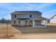 View of the home's backyard featuring a covered patio at 112 Felicity Pike, Locust Grove, GA 30248