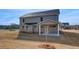 A spacious backyard and covered patio at 112 Felicity Pike, Locust Grove, GA 30248