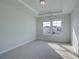 Neutral bedroom features tray ceiling, large windows and plenty of sunlight at 112 Felicity Pike, Locust Grove, GA 30248
