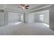 Large bedroom features neutral walls, carpet flooring, and natural light at 112 Felicity Pike, Locust Grove, GA 30248