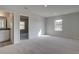 Spacious bedroom featuring an ensuite bathroom and an adjacent flex space at 112 Felicity Pike, Locust Grove, GA 30248