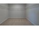 Spacious walk-in closet with carpet and white wire shelving at 112 Felicity Pike, Locust Grove, GA 30248