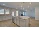 Gourmet kitchen boasts island with seating, stainless steel appliances, and ample counter space at 112 Felicity Pike, Locust Grove, GA 30248