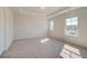 Neutral bedroom featuring tray ceiling, recessed lighting, and abundant natural light from the large windows at 120 Felicity Pike, Locust Grove, GA 30248