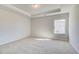 Neutral bedroom featuring tray ceiling, recessed lighting, and a large window providing plenty of natural light at 120 Felicity Pike, Locust Grove, GA 30248