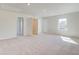 Spacious bonus room with neutral carpeting, recessed lighting, and multiple doors creating an open and versatile living area at 120 Felicity Pike, Locust Grove, GA 30248