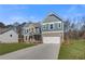 Beautiful two-story home with a blend of brick and siding, complemented by a green lawn and a spacious two-car garage at 120 Felicity Pike, Locust Grove, GA 30248