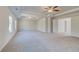 Spacious bedroom with tray ceiling, recessed lights, and large doorway to the connected bathroom at 120 Felicity Pike, Locust Grove, GA 30248
