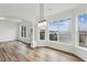 Bright dining area featuring beautiful wood-look floors and an abundance of natural light at 326 Oakview Way, Canton, GA 30114