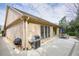 Spacious backyard features a stone wall, patio, grill, and lots of space for activities at 620 Willow Haven Way, Suwanee, GA 30024