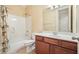 Well-lit bathroom with bathtub/shower combination and vanity at 620 Willow Haven Way, Suwanee, GA 30024
