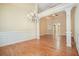 Formal dining room with hardwood floors, wainscoting, a chandelier, and an open floor plan at 620 Willow Haven Way, Suwanee, GA 30024