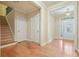 Bright entryway features hardwood floors, staircase, and natural light through the front door at 620 Willow Haven Way, Suwanee, GA 30024