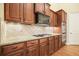 Beautiful kitchen featuring a range, tile backsplash, granite countertop, and custom cabinetry at 620 Willow Haven Way, Suwanee, GA 30024
