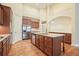 Spacious kitchen featuring a granite island, stainless steel appliances, and custom wood cabinets at 620 Willow Haven Way, Suwanee, GA 30024
