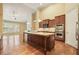 Gourmet kitchen with a granite island, stainless steel appliances, and beautiful cabinetry at 620 Willow Haven Way, Suwanee, GA 30024