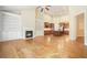 Spacious living room with fireplace, built-in bookshelves, hardwood floors, and open access to the kitchen at 620 Willow Haven Way, Suwanee, GA 30024