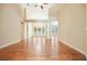 Open-concept living area featuring hardwood floors, high ceilings, and large windows at 620 Willow Haven Way, Suwanee, GA 30024