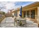 A charming patio with a round wooden table set and grill for outdoor gatherings at 620 Willow Haven Way, Suwanee, GA 30024