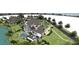 Extensive aerial view of the property featuring a pool, pond, and meticulously landscaped grounds at 1075 Lancaster Sq, Roswell, GA 30076