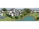 Expansive aerial view of the property with a swimming pool and a serene pond at 1075 Lancaster Sq, Roswell, GA 30076