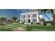Attractive home featuring a manicured front yard and a two-story porch at 1075 Lancaster Sq, Roswell, GA 30076