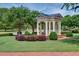 Charming gazebo surrounded by manicured lawns and hedges with walkable brick sidewalks at 1075 Lancaster Sq, Roswell, GA 30076