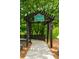 Inviting Old Mill Park entrance with wooden pergola and lush greenery at 1075 Lancaster Sq, Roswell, GA 30076