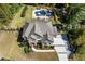 Aerial view of the home, highlighting the lush landscaping, spacious backyard, and outdoor pool at 3111 Old Thompson Mill Rd, Buford, GA 30519
