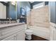 Stylish bathroom with tiled tub, granite vanity, custom mirror and modern fixtures at 3111 Old Thompson Mill Rd, Buford, GA 30519