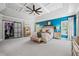 Main bedroom features a trey ceiling with accent lighting, a walk-in closet, and a large window at 3111 Old Thompson Mill Rd, Buford, GA 30519