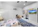 Spacious bedroom featuring ceiling fan, tv and decor at 3111 Old Thompson Mill Rd, Buford, GA 30519