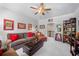 Inviting bonus room features plush seating, ample storage, and large-screen television for entertainment at 3111 Old Thompson Mill Rd, Buford, GA 30519