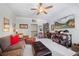 Inviting bonus room features plush seating, ample storage, and large-screen television for entertainment at 3111 Old Thompson Mill Rd, Buford, GA 30519