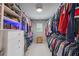 Walk-in closet with custom shelving and hanging space at 3111 Old Thompson Mill Rd, Buford, GA 30519