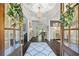 Welcoming foyer featuring hardwood floors, elegant lighting, and a decorative rug at 3111 Old Thompson Mill Rd, Buford, GA 30519