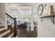 Open-concept living area showcases hardwood floors, natural light, and coffered ceiling details at 3111 Old Thompson Mill Rd, Buford, GA 30519