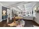Open-concept living space with eat-in kitchen, access to the main living room, and hardwood floors at 3111 Old Thompson Mill Rd, Buford, GA 30519